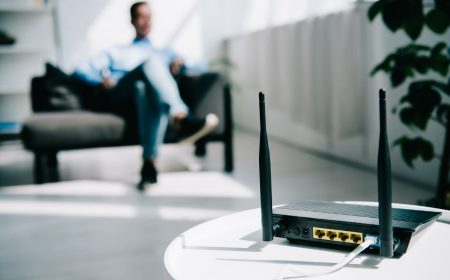 selective-focus-of-black-plugged-router-on-white-t-2023-11-27-05-34-33-utc (1)